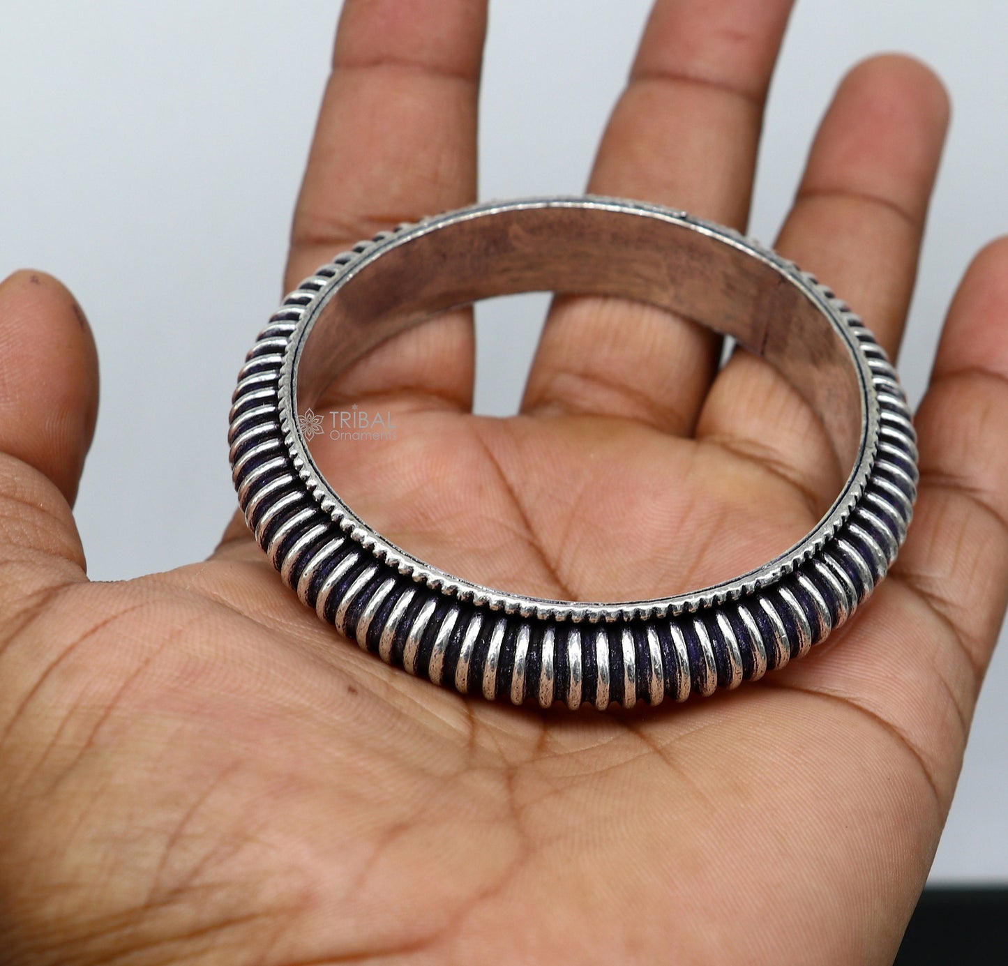 Unisex 925 Sterling silver tribal bangle bracelet with modern trendy design and cultural patterns by TRIBAL ORNAMENTS.