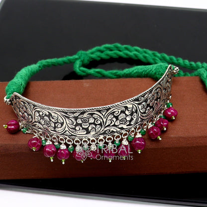 Sterling silver Nakshi work charm necklace choker featuring tribal ethnic designs inspired by Rajasthan cultural heritage.