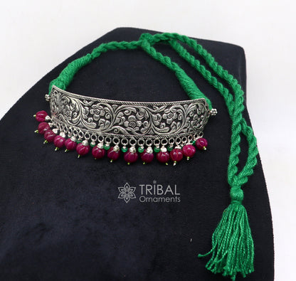 925 sterling silver Nakshi work charm necklace choker featuring tribal ethnic jewelry inspired by Rajasthan cultural heritage.