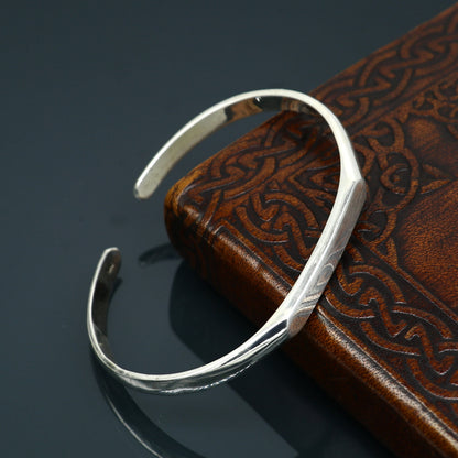 Shiny 925 sterling silver bangle cuff bracelet with a sleek design, adjustable fit, ideal for unisex personal gifting by Tribal Ornaments.