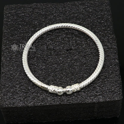 Sterling silver bangle bracelet by Tribal Ornaments, shiny and bright, stylish jewelry for men or girls, perfect for personalized gifting.