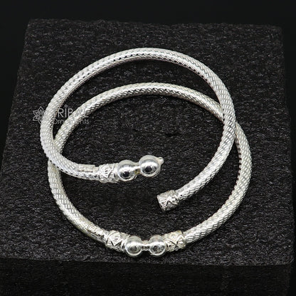 Sterling silver bangle bracelet by Tribal Ornaments, shiny and bright, stylish jewelry for men or girls, perfect for personalized gifting.