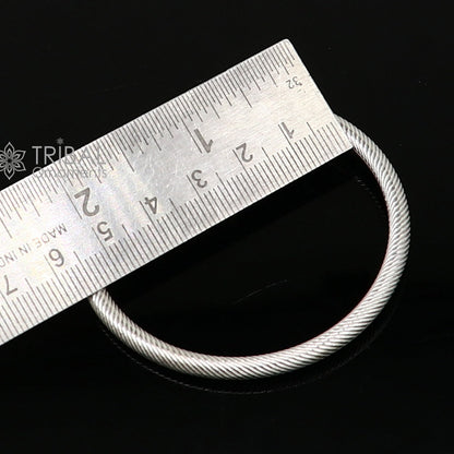 Shiny 925 sterling silver bangle bracelet by Tribal Ornaments, stylish and personalized jewelry for men or women.