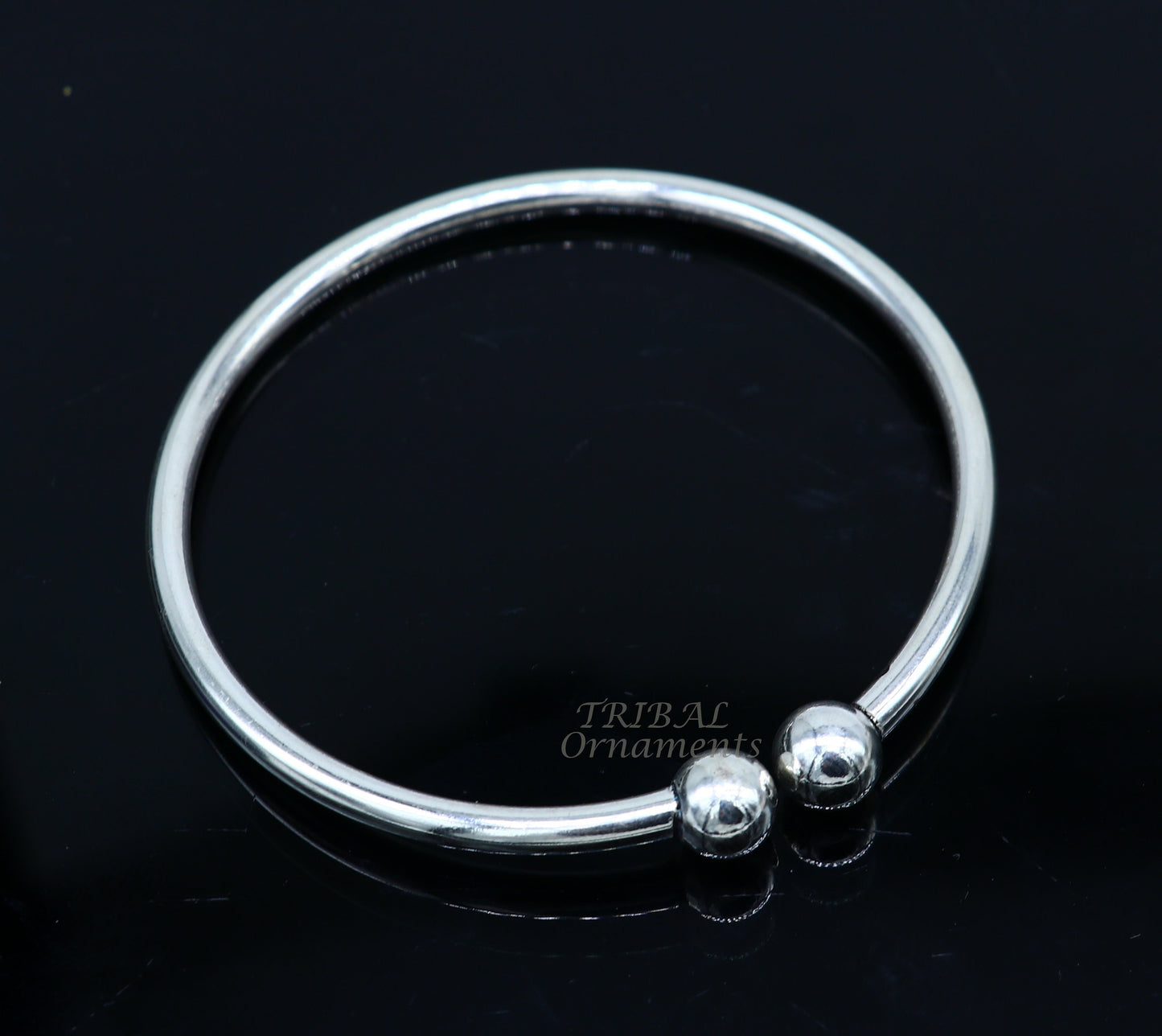 Sterling silver round bangle bracelet with shiny, customized design by TRIBAL ORNAMENTS, perfect for brides or belly dance jewelry.