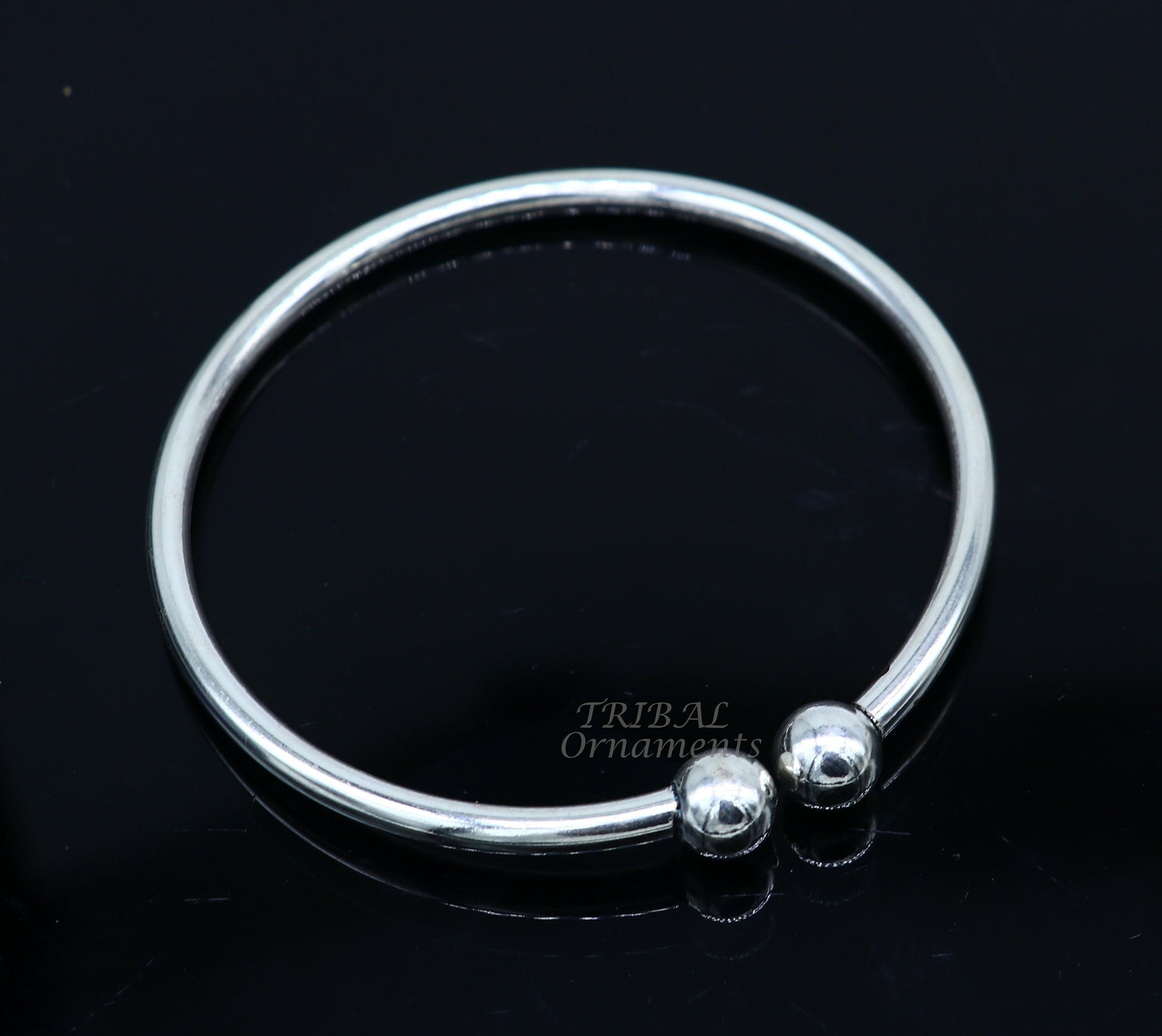 Sterling silver round bangle bracelet with shiny, customized design by TRIBAL ORNAMENTS, perfect for brides or belly dance jewelry.