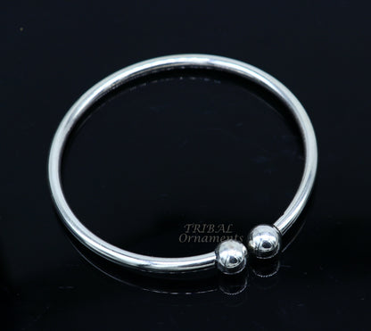 Sterling silver round bangle bracelet with shiny, customized design by TRIBAL ORNAMENTS, perfect for brides or belly dance jewelry.