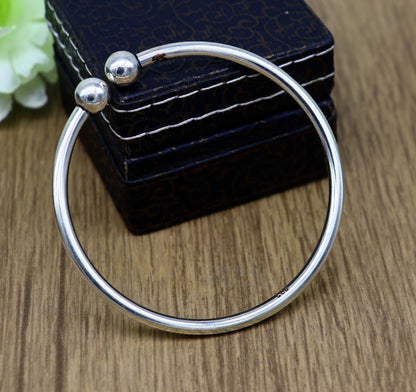 Sterling silver round bangle bracelet with shiny, customizable design, stylish jewelry for brides and belly dance performances.
