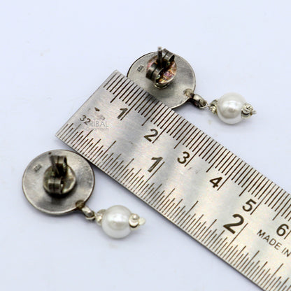 925 sterling silver handmade round stud earrings featuring tribal design from Rajasthan India, crafted by TRIBAL ORNAMENTS.