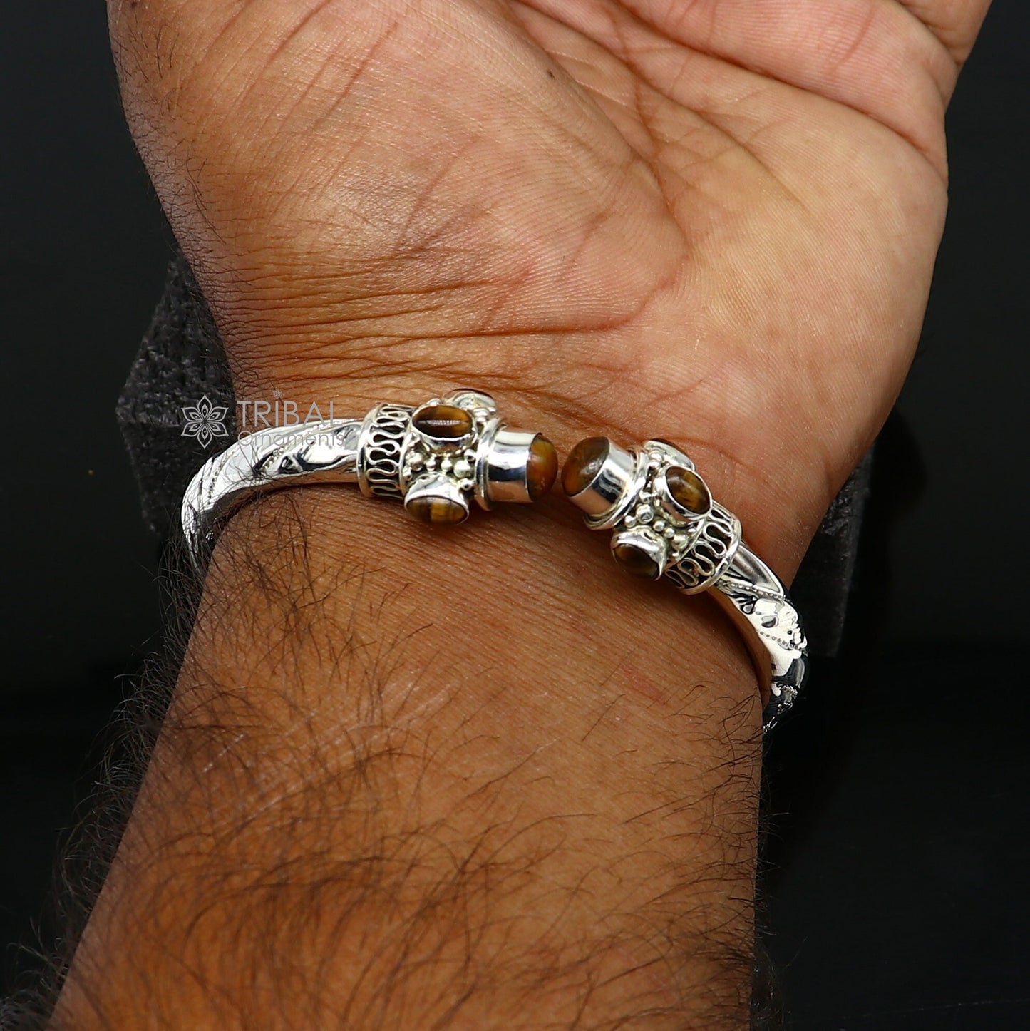 Unisex 925 sterling silver tiger eye stone bangle bracelet with engraved design, showcasing tribal-inspired jewelry style.