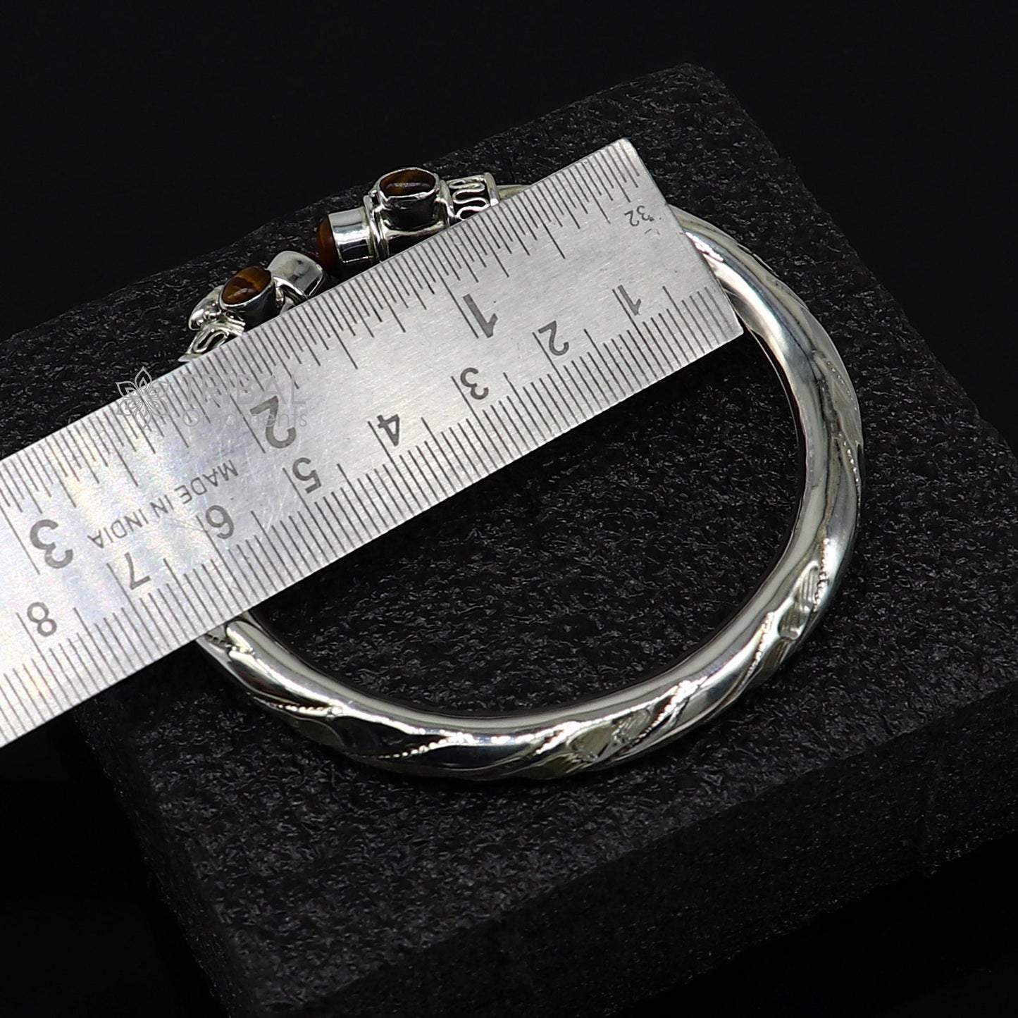Unisex 925 sterling silver tiger eye stone bangle bracelet with intricate tribal design, customized jewelry by Tribal Ornaments.