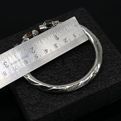 Unisex 925 sterling silver tiger eye stone bangle bracelet with intricate tribal design, customized jewelry by Tribal Ornaments.