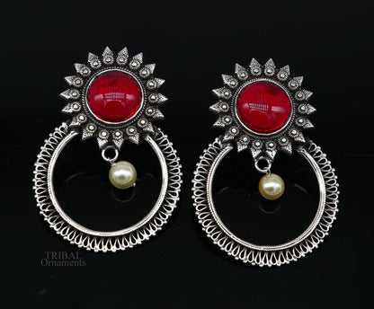 Handmade 925 sterling silver tribal style stud earrings with glossy red stones, showcasing traditional ethnic design.