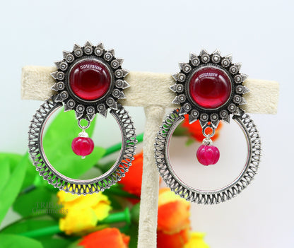 Sterling silver tribal-style stud earrings with vibrant red glossy stone, handcrafted ethnic jewelry by TRIBAL ORNAMENTS.