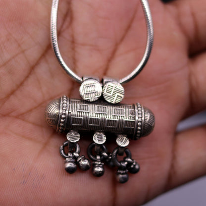 Sterling silver tribal amulet pendant with traditional design, crafted by TRIBAL ORNAMENTS for ethnic jewelry collection.