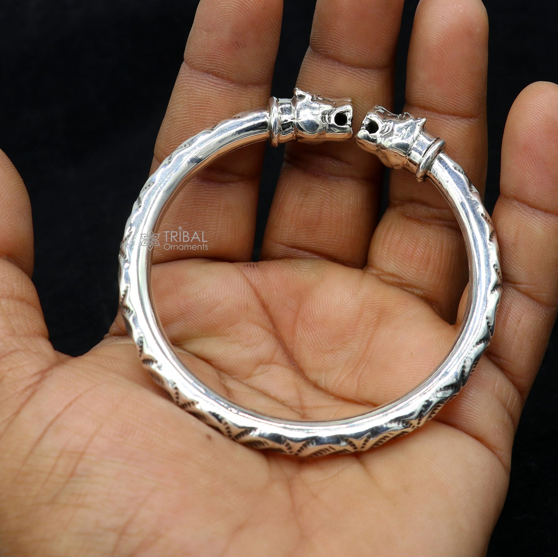 Sterling silver lion face kada bracelet by TRIBAL ORNAMENTS, featuring tribal design and attractive craftsmanship.