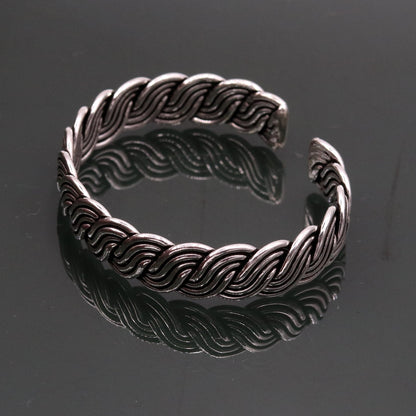 925 sterling silver twisted open-face adjustable bangle cuff bracelet with tribal design by TRIBAL ORNAMENTS.