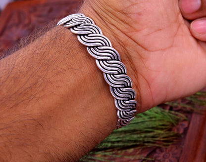 Sterling silver twisted open face adjustable bangle cuff bracelet with tribal design from TRIBAL ORNAMENTS.