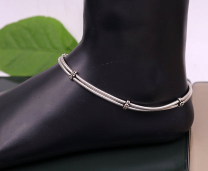 Sterling silver two-line snake chain ankle bracelet by TRIBAL ORNAMENTS, stylish belly dance-inspired foot jewelry.