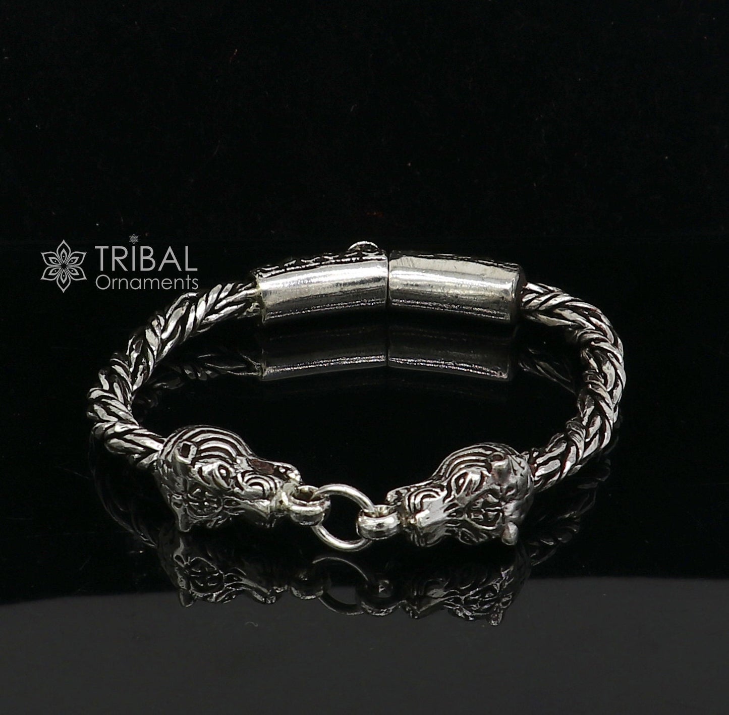 Sterling silver chain bracelet with lion face design by TRIBAL ORNAMENTS, featuring antique style and stylish jewelry details.