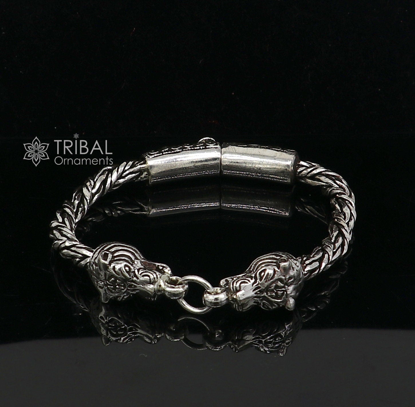 Sterling silver chain bracelet with lion face design by TRIBAL ORNAMENTS, featuring antique style and stylish jewelry details.