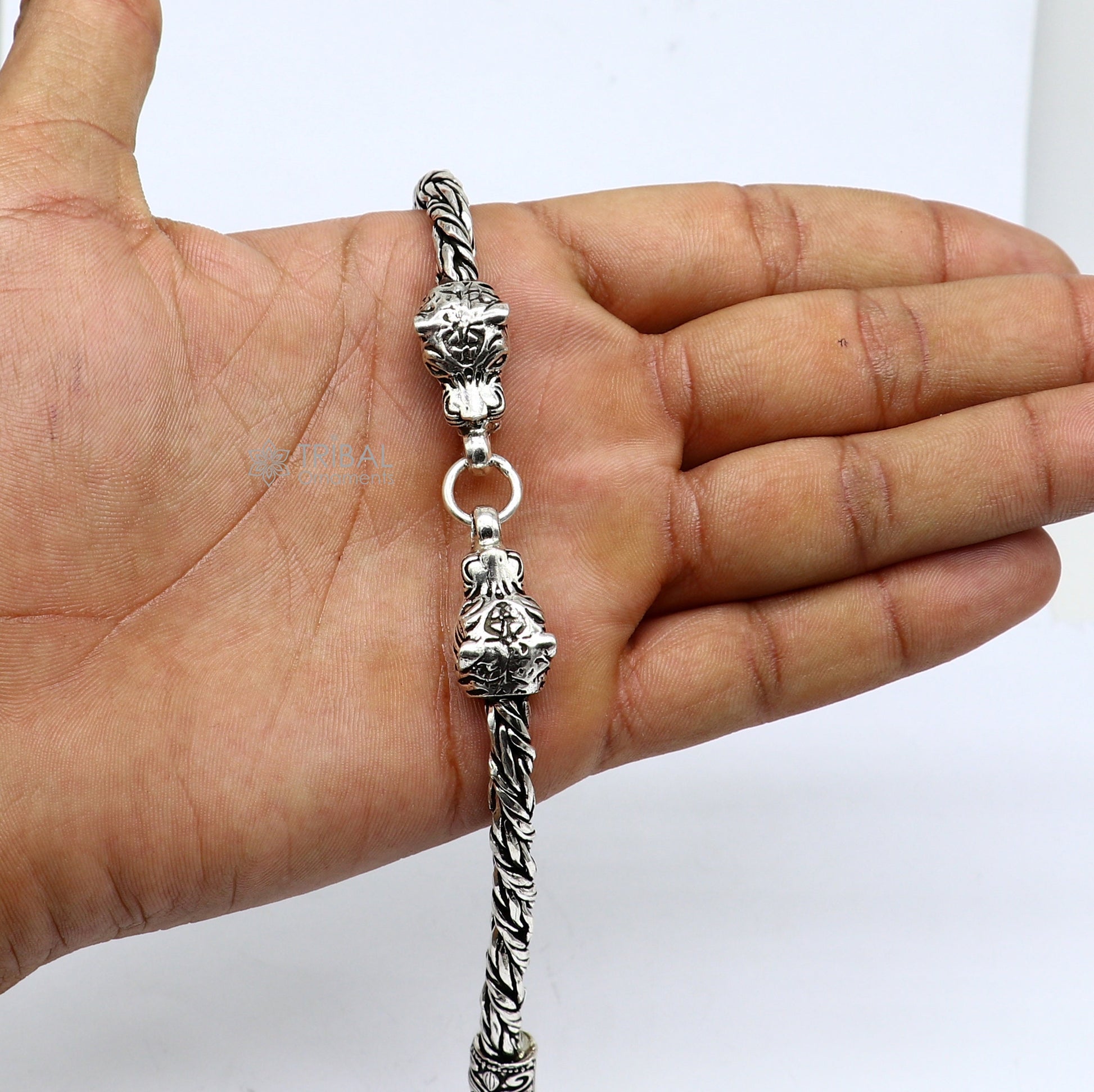 Sterling silver chain bracelet with lion face design by TRIBAL ORNAMENTS, showcasing a stylish and unique jewelry piece.