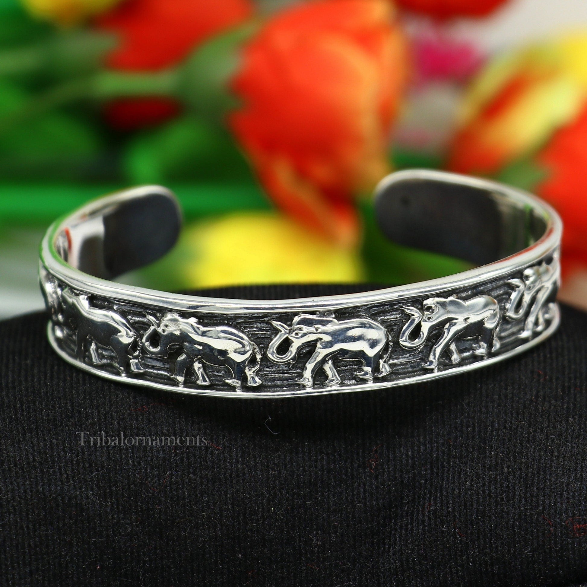 Handcrafted 925 sterling silver elephant cuff bracelet with adjustable tribal design, unisex ethnic jewelry by Tribal Ornaments.