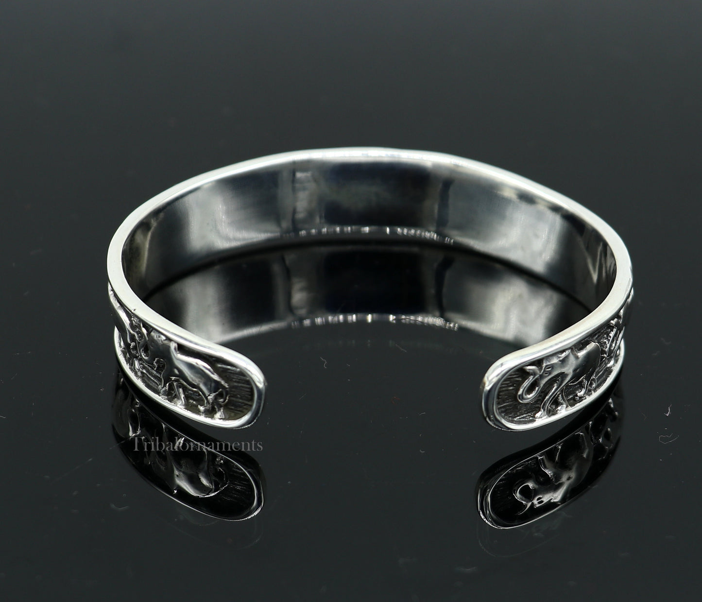 Sterling silver handcrafted elephant design cuff bangle bracelet by TRIBAL ORNAMENTS, adjustable unisex tribal jewelry accessory.