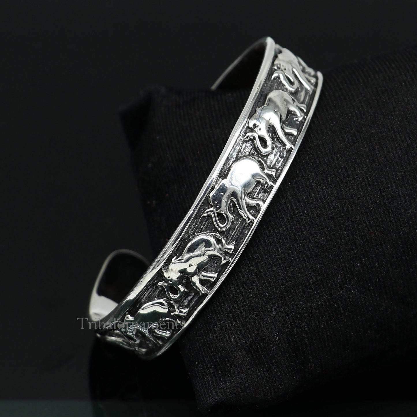 Sterling silver handcrafted adjustable elephant design cuff bangle bracelet by Tribal Ornaments, unisex tribal jewelry accessory.