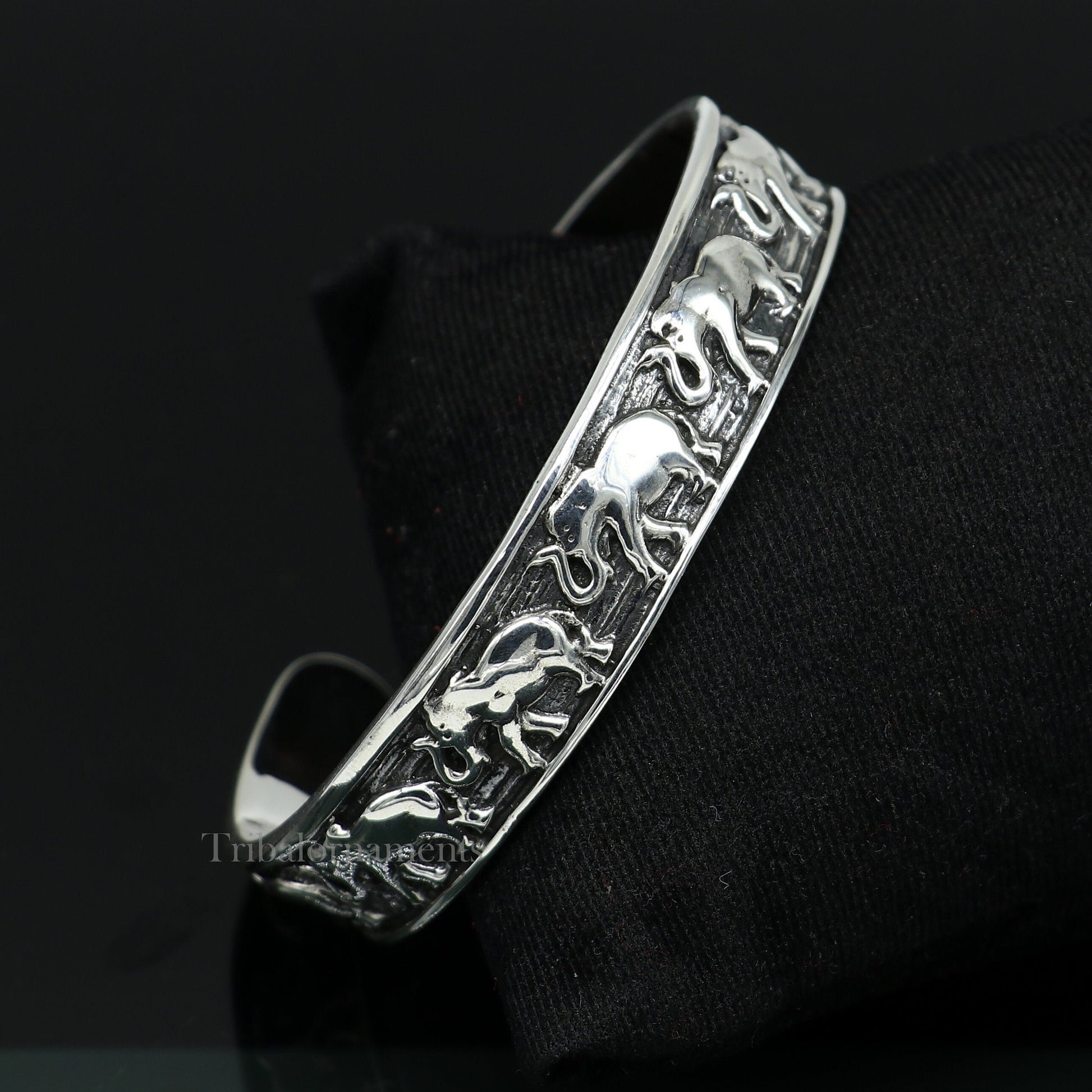 Sterling silver handcrafted adjustable elephant design cuff bangle bracelet by Tribal Ornaments, unisex tribal jewelry accessory.