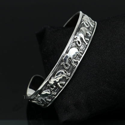 Sterling silver handcrafted adjustable elephant design cuff bangle bracelet by Tribal Ornaments, unisex tribal jewelry accessory.