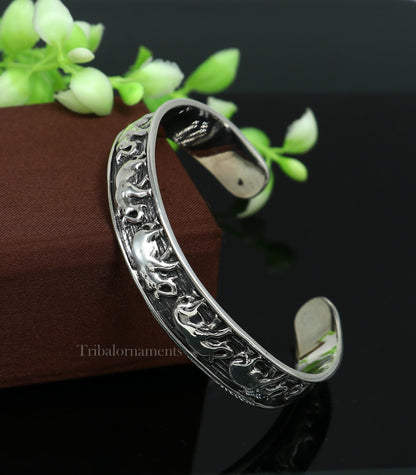Sterling silver handcrafted elephant design cuff bracelet by TRIBAL ORNAMENTS, unisex tribal jewelry with adjustable fit.