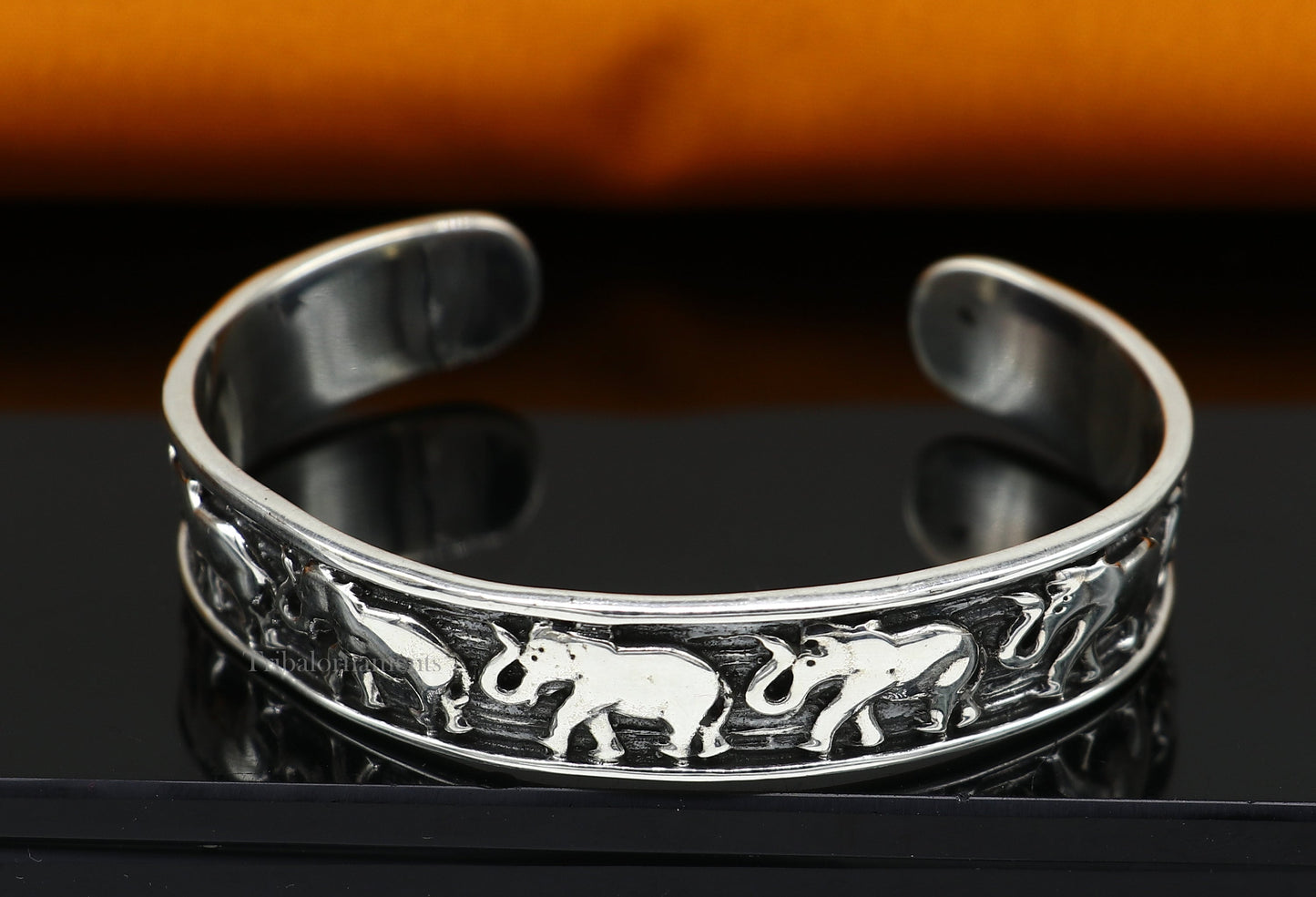 Sterling silver handcrafted elephant cuff bracelet by Tribal Ornaments, adjustable unisex tribal jewelry with ethnic elephant design.