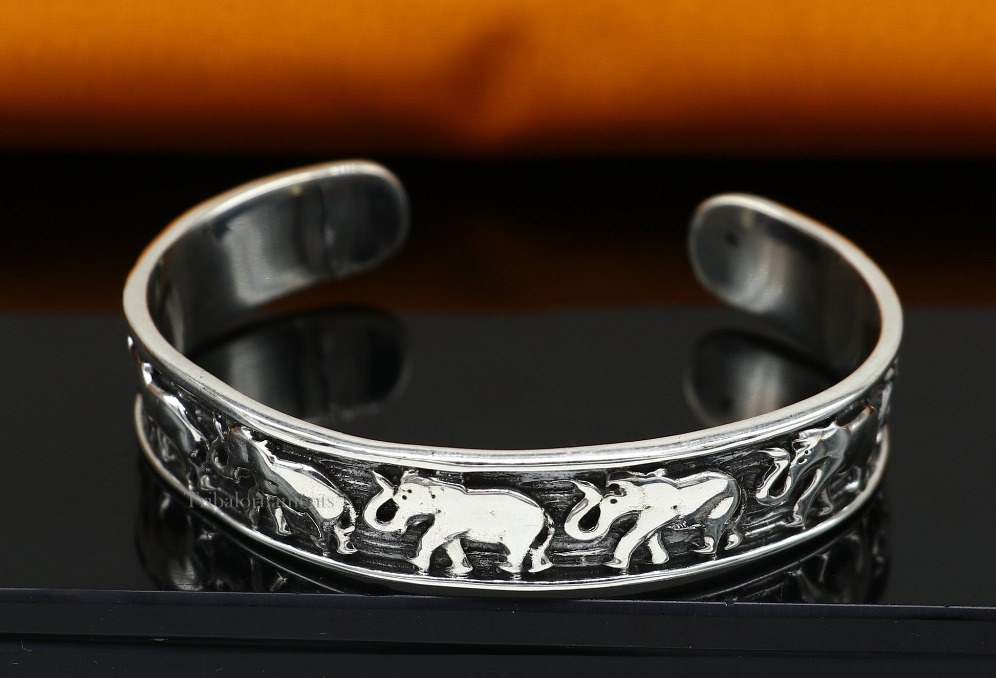 Sterling silver handcrafted elephant cuff bracelet by Tribal Ornaments, adjustable unisex tribal jewelry with ethnic elephant design.