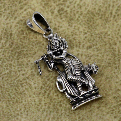 Sterling silver Krishna with cow pendant, vintage-style Hindu jewelry, detailed tribal ornament design for gifting or collection