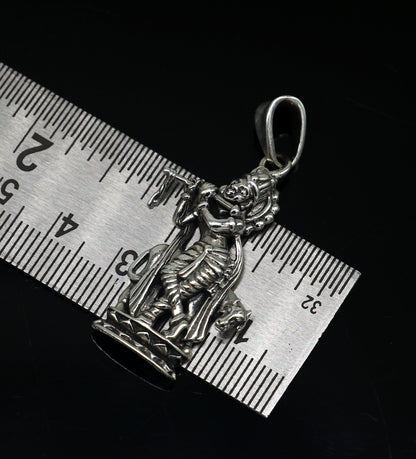 Sterling silver Krishna with cow pendant jewelry by TRIBAL ORNAMENTS, featuring intricate Hindu idol design and vintage style.