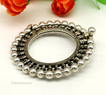 Sterling silver vintage tribal bangle bracelet with ethnic design, featuring antique jewelry style and Banjara belly dance-inspired details.