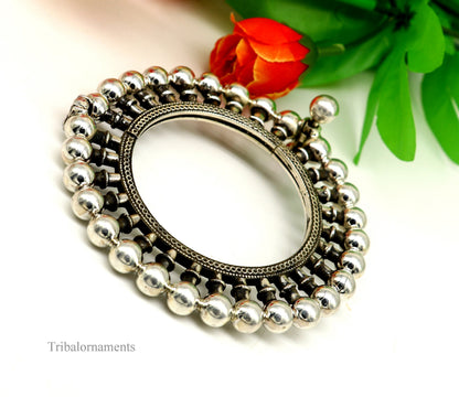 Sterling silver vintage tribal bangle bracelet with ethnic design, antique jewelry style, featuring intricate patterns and cuff style.