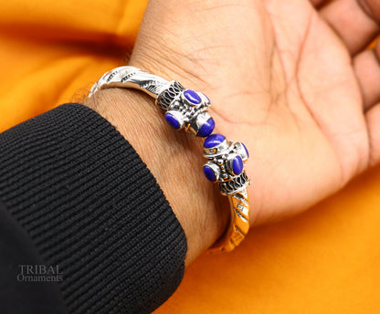 Sterling silver vintage-style stone jadau bangle bracelet, traditional unisex jewelry with intricate design and craftsmanship.