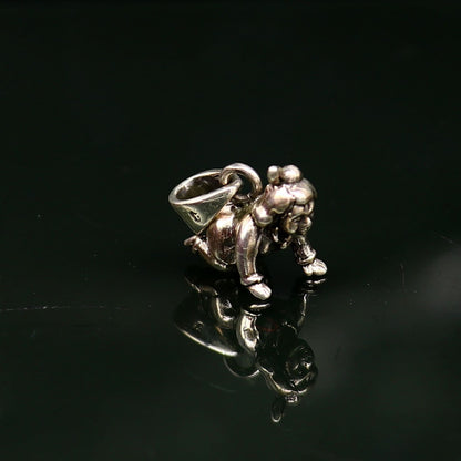 Sterling silver Little Bal Gopal Krishna pendant, small crawling Krishna idol for home temple or puja, from Tribal Ornaments.