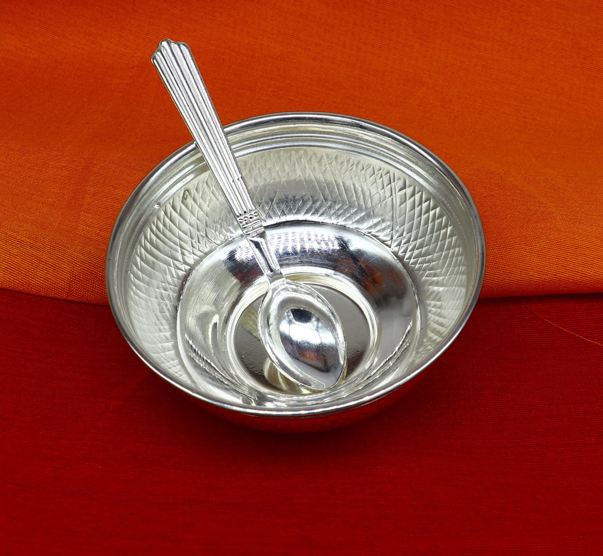 Handcrafted 999 fine silver baby bowl and spoon set from TRIBAL ORNAMENTS, traditional puja silver utensils and vessels.