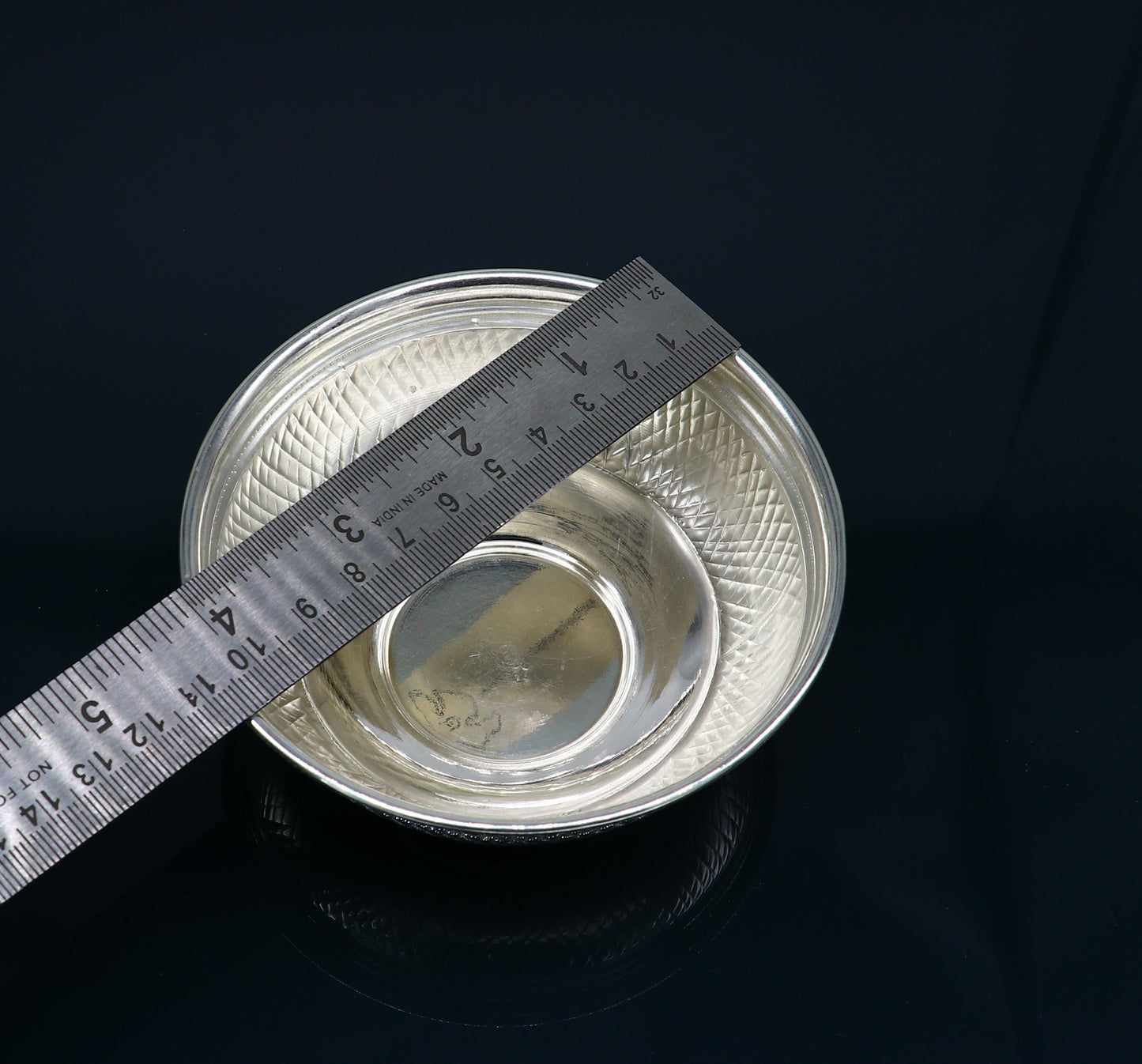 Handcrafted 999 fine silver baby bowl and spoon set by TRIBAL ORNAMENTS, traditional silver puja utensils for infants.