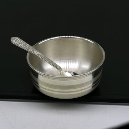 Handmade 999 fine silver bowl and spoon set by TRIBAL ORNAMENTS, featuring antibacterial silver for kids' health and safety.