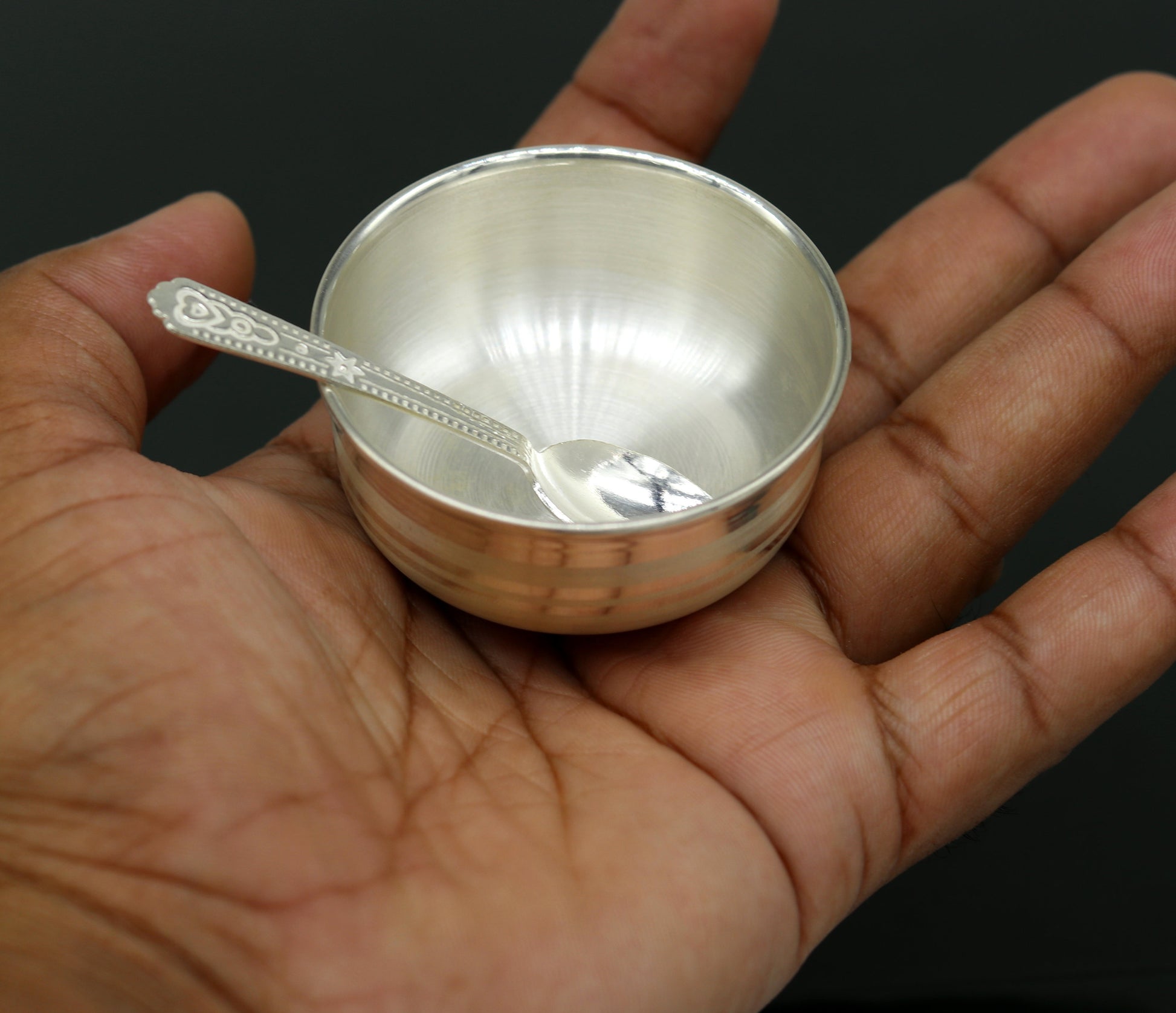 Handmade 999 fine silver bowl and spoon set with antibacterial properties, ideal for keeping babies and kids healthy.