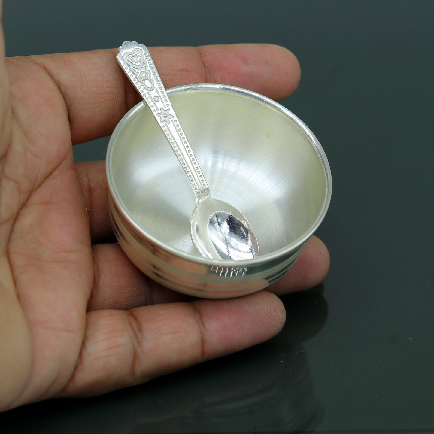 Handmade 999 fine silver bowl and spoon set by TRIBAL ORNAMENTS, featuring antibacterial silver for kids' health and safety.