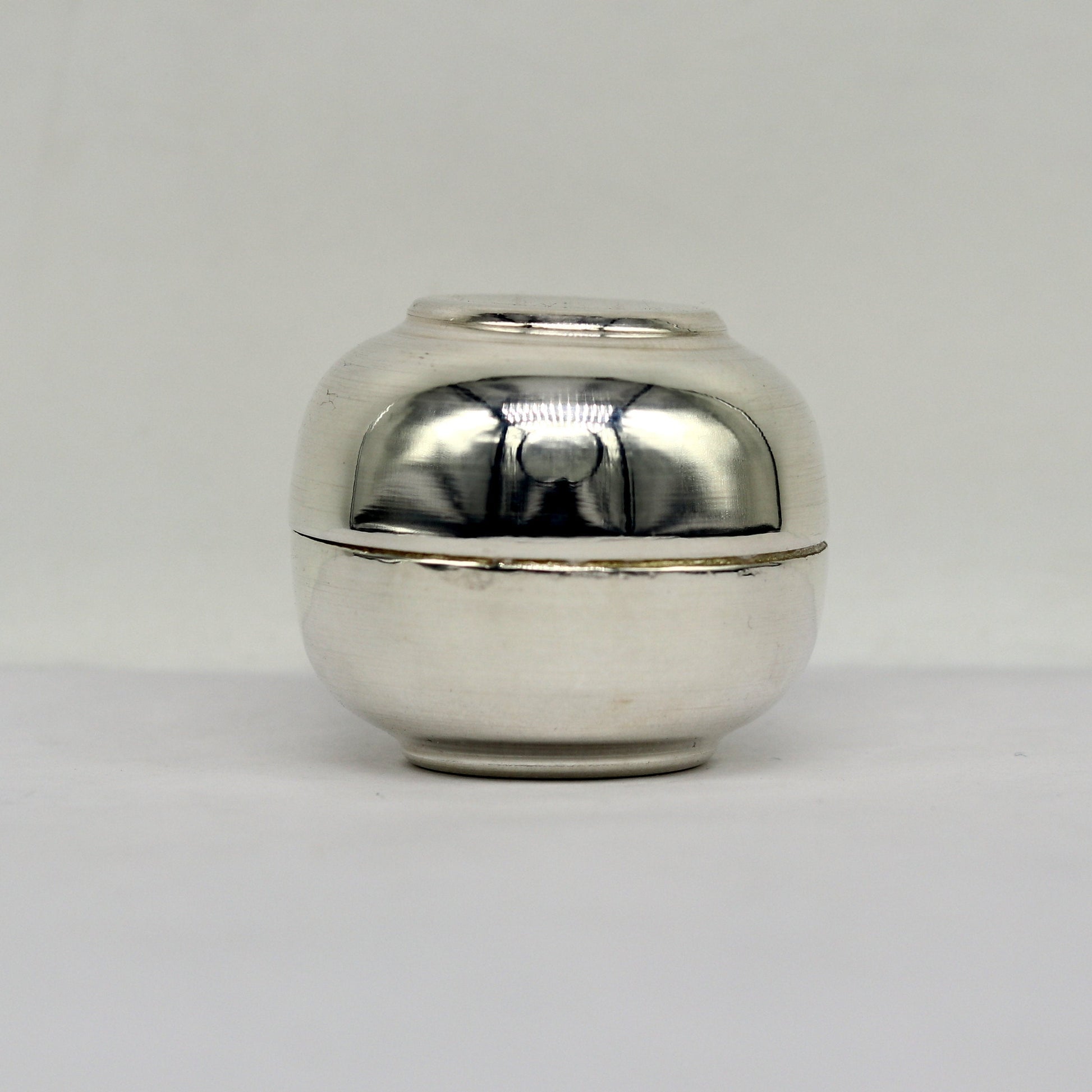 Handmade 999 fine silver idol prasad and trinket box with intricate design, suitable as a brides sindur or jewelry container.