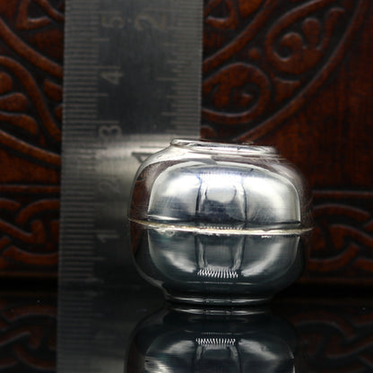 Handmade 999 fine silver small idol Prasad box and trinket container with intricate tribal design, solid silver utensil.