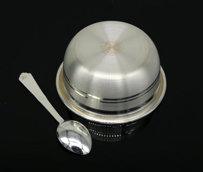 Handmade 999 fine silver bowl and spoon set for food serving, tribal ornaments style, ideal for puja or baby gift purposes.