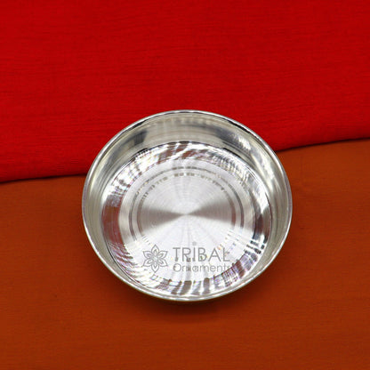 Handmade 999 fine silver tray for serving baby food, part of TRIBAL ORNAMENTS silver utensils and puja silver articles collection.
