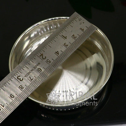 Handmade 999 fine silver tray for serving baby food, part of tribal silver utensils collection, ideal for gifting and puja ceremonies.