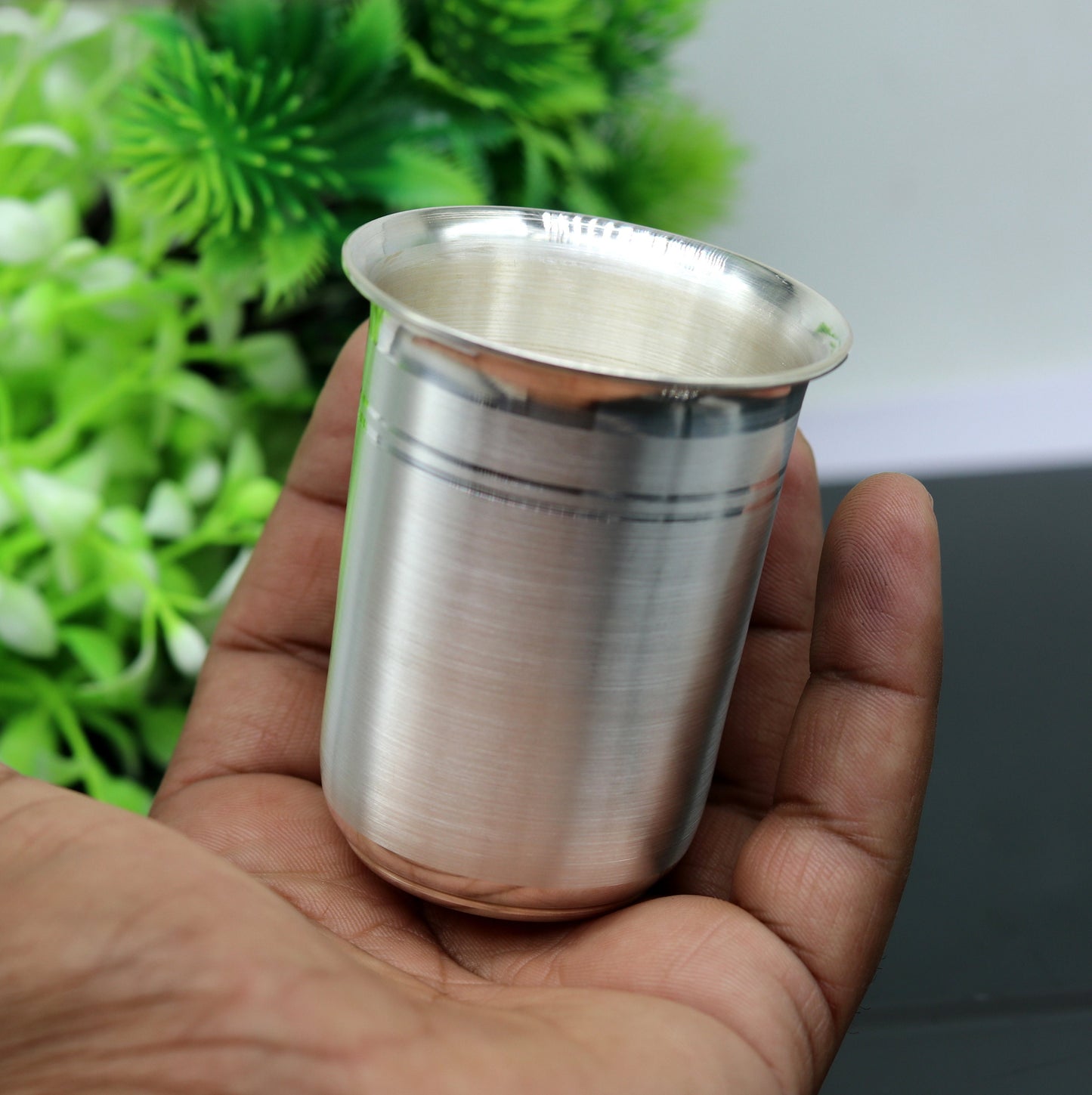 Handmade 999 fine silver milk tumbler and flask by Tribal Ornaments, featuring intricate designs for health and rice ceremony use.